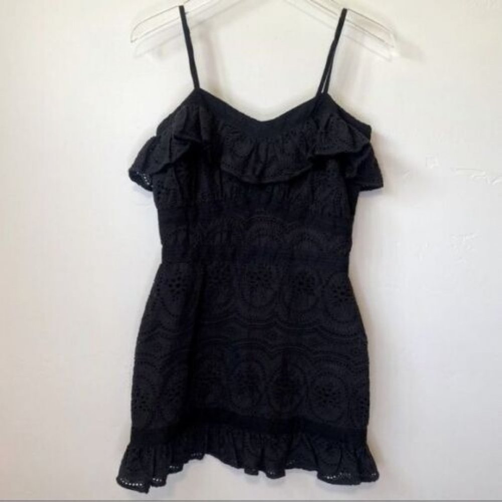 Fully lined Adjustable straps Embroidered eyelet fabric Ruffled trim Hidden back